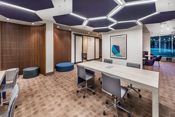 A conference room with a long table and chairs. at Morea Apartments, Pompano Beach, 33062